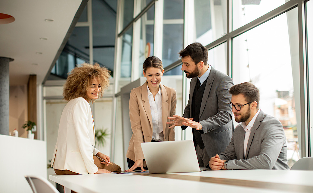 Group of business men and women working together in the office